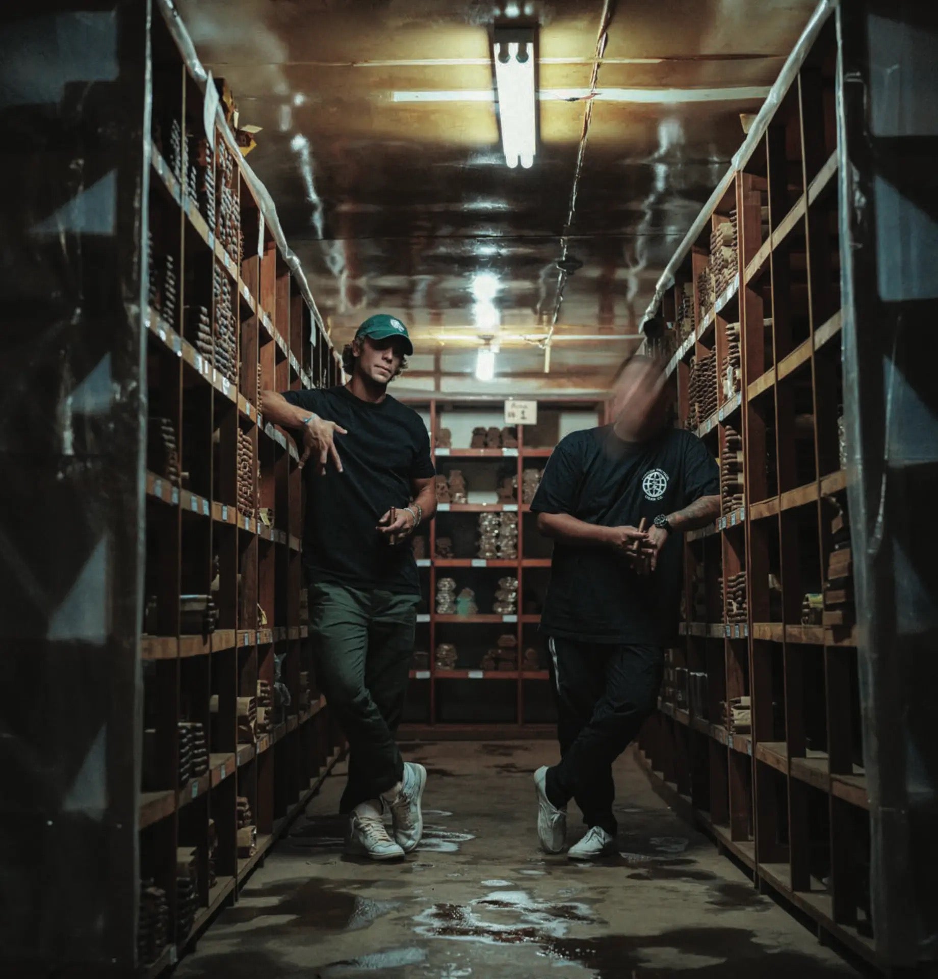 Tobacco Tactical founders inside a cigar aging warehouse