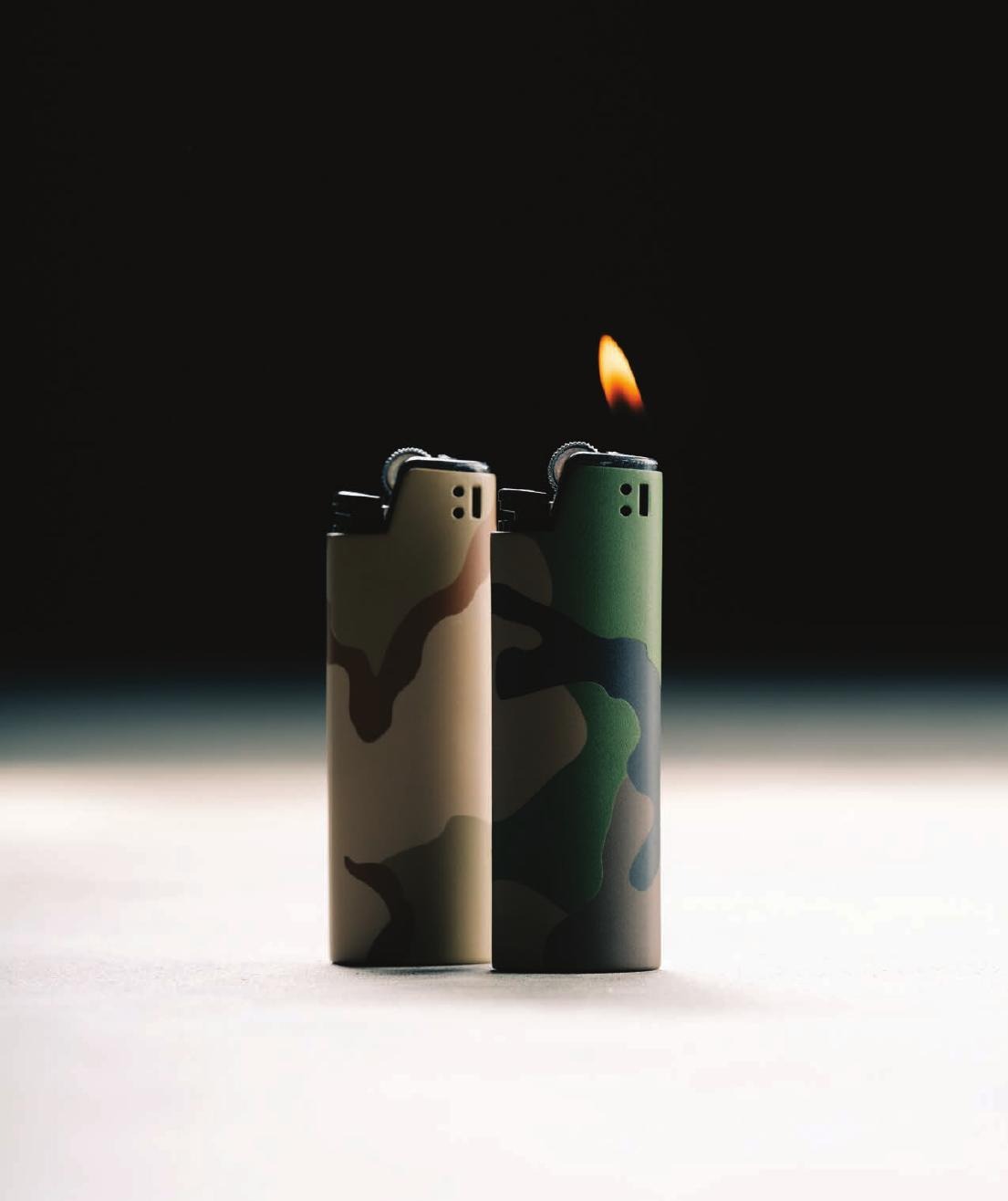 Camo Tobacco Tactical lighters, one lit