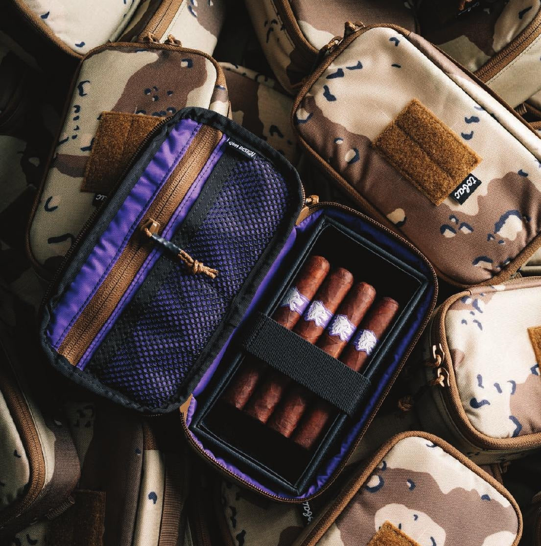Open Tobacco Tactical vault case loaded with cigars